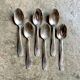 6 silver metal spoons