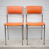 Pair of chrome metal chair and orange skai