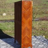 Glass library with rosewood marquetry in the Louis XV style.