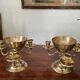 Pair of solid brass calyx candlesticks