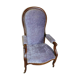 Relaxed Voltaire armchair with walnut racks