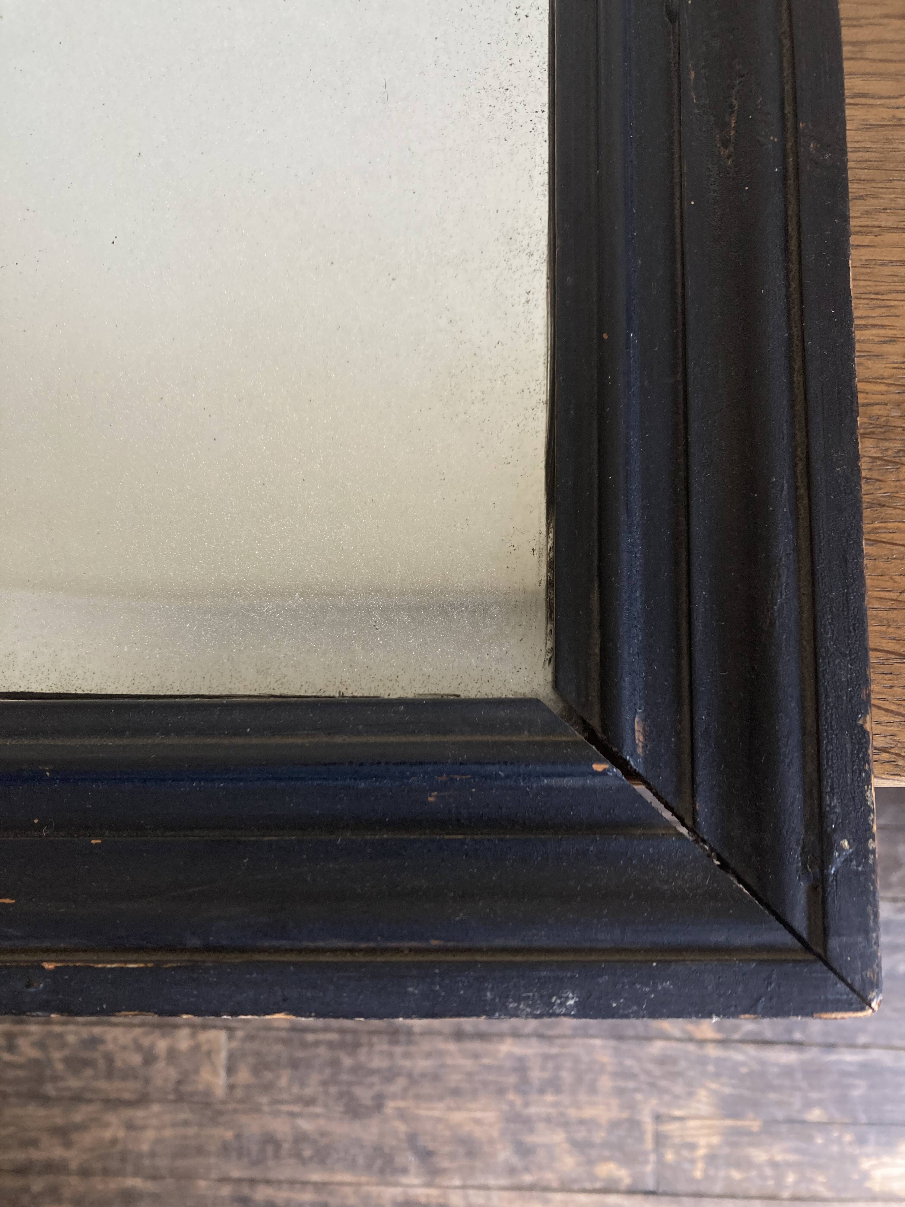 19th century blackened mirror with pitted glass 34cm x 40cm