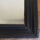 19th century blackened mirror with pitted glass 34cm x 40cm