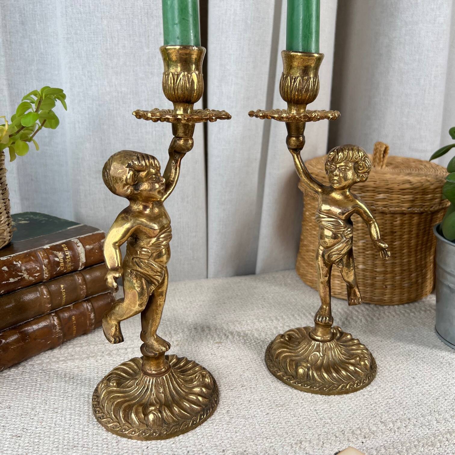 Pair of bronze “Cherubim” candlesticks