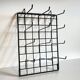 Vintage black metal wall loom display