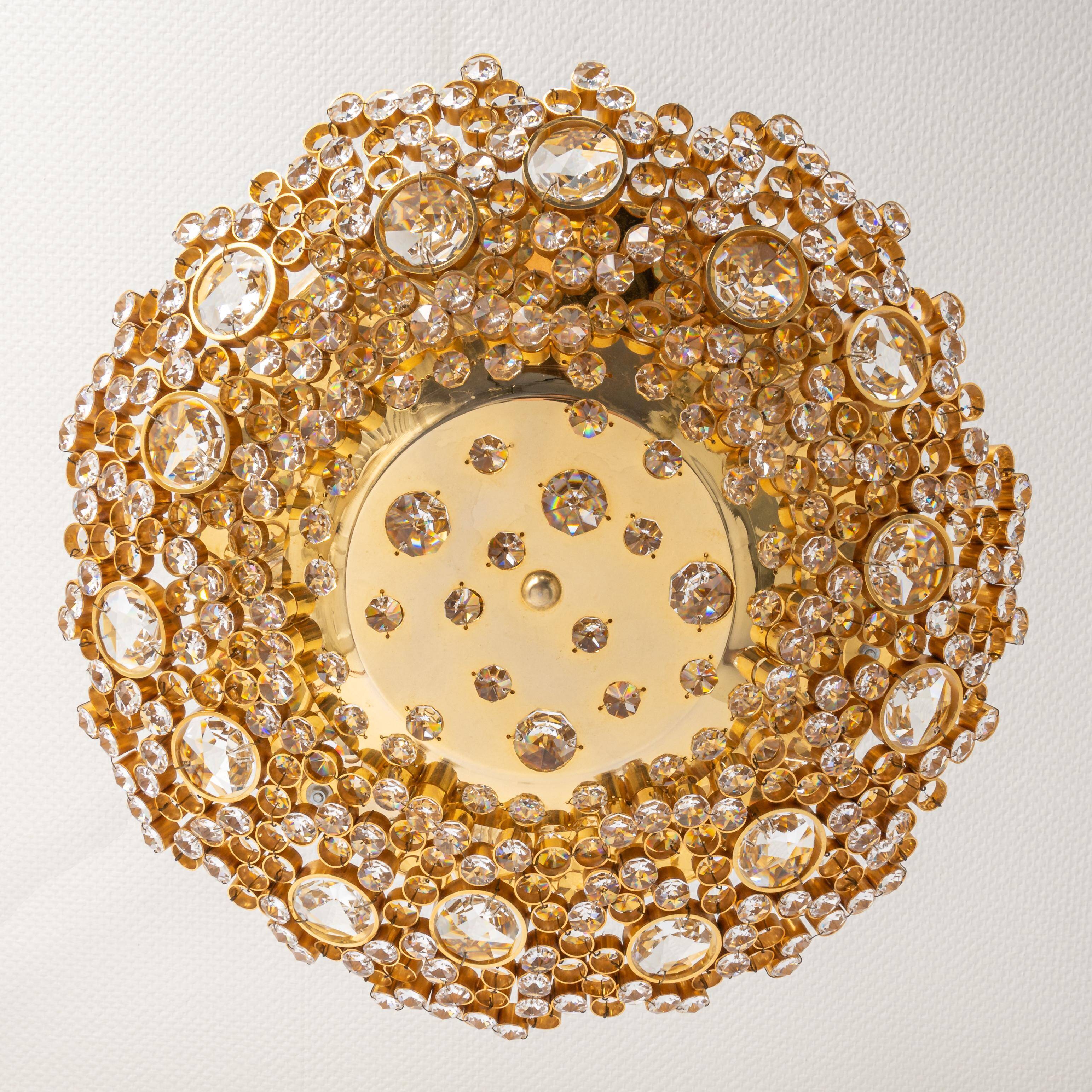 Floral wall light in gilded brass and cut glass by Palwa, Germany, 1970s.