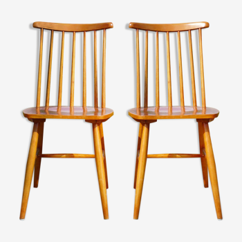 Two Scandinavian chairs in blond wood with bars