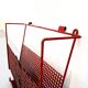 Vintage magazine rack in red lacquered perforated metal from the 70s