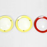 Three round 1950s wall or ceiling lamps made of metal and plexiglass shades
