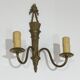 Pair of Louis XVI style bronze wall sconces with quivers and ribbons