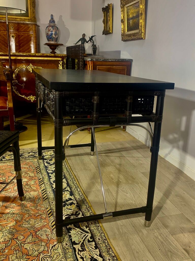 Office with its rattan armchair and brown leather braiding, italian design