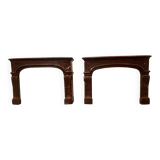 Pair of Louis XIV style fireplaces in red cherry marble. XIX century.