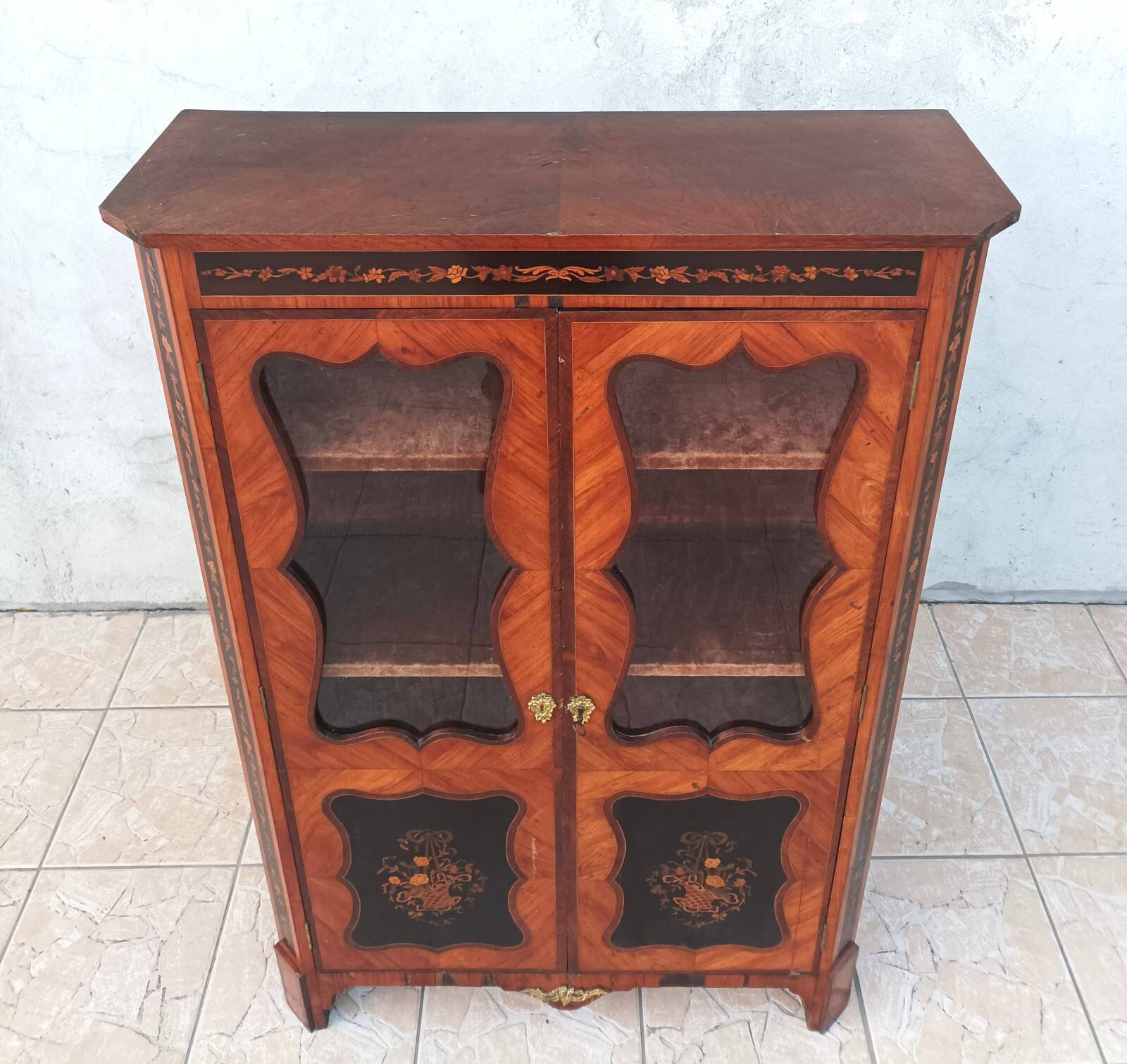 Louis XVI glass-fronted library in rosewood and amaranth veneer.