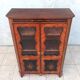 Louis XVI glass-fronted library in rosewood and amaranth veneer.