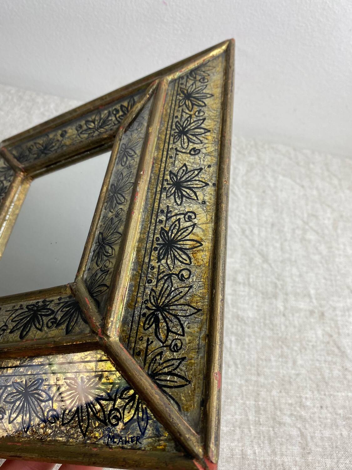 Eglomisé mirror with wooden parecloses