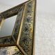Eglomisé mirror with wooden parecloses
