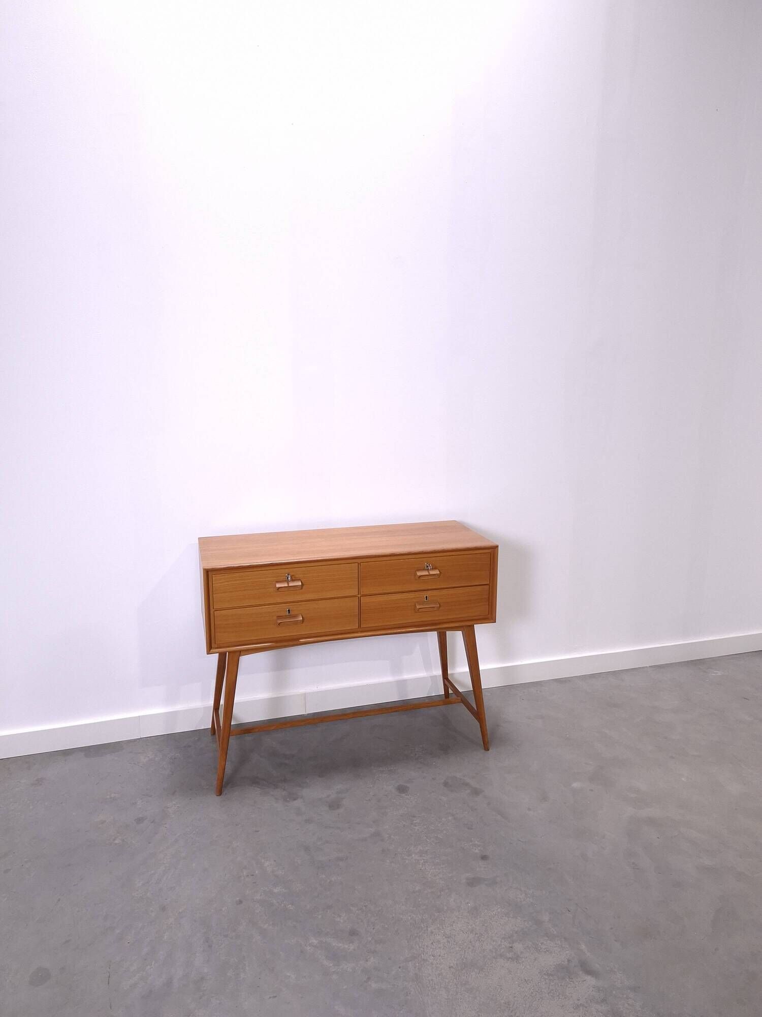 Vintage teak Danish chest of drawers with high slanted legs, side table, sideboard.