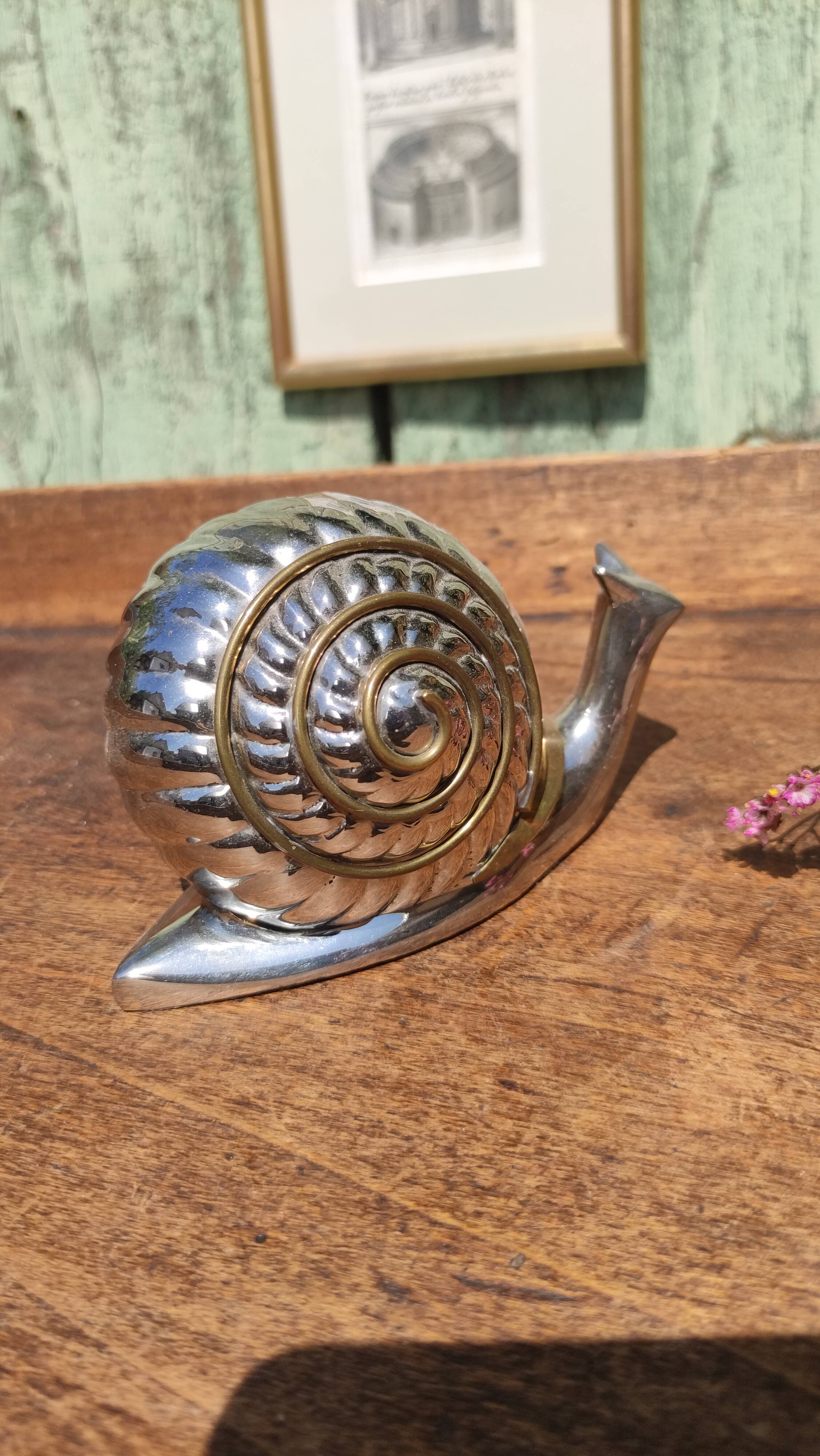 Vintage ashtray in silver and gold metal in the shape of a snail