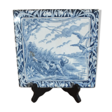 Old tile in Gien earthenware decoration hunting dog
