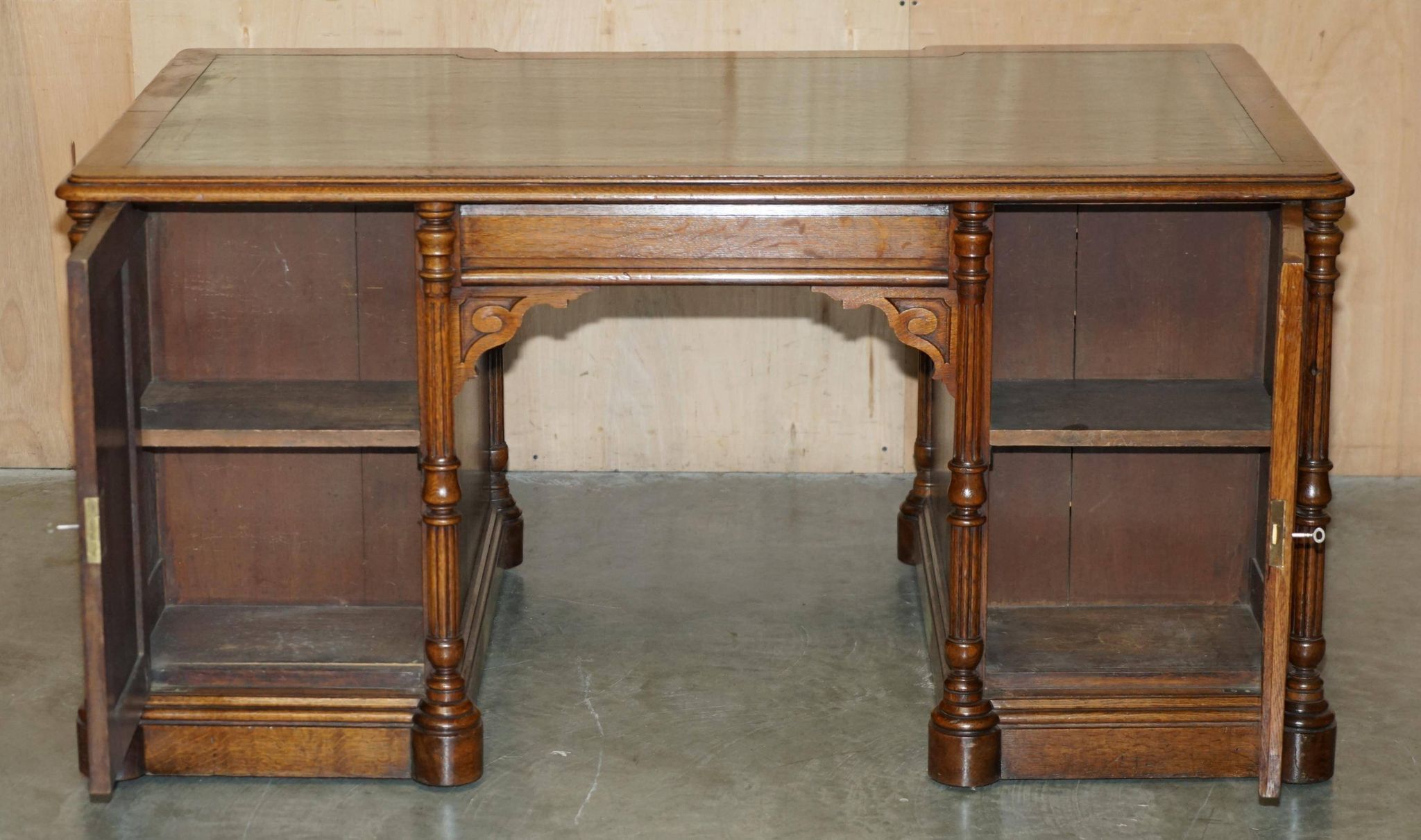 Antique double-sided desk C Hindley & Son in oak and leather