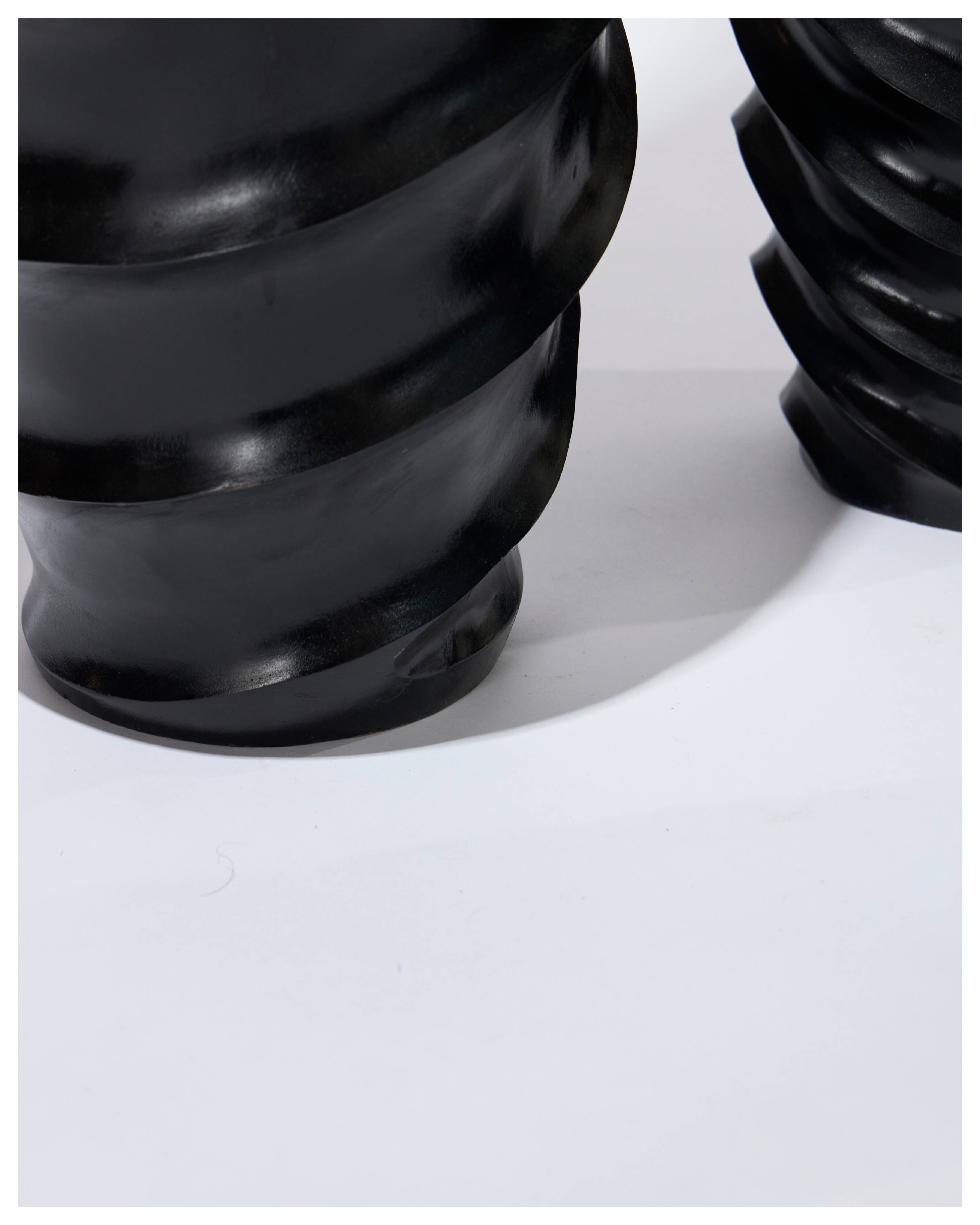 Set of 3 large black vases made of wood and black lacquered.