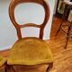 Pair of wooden chairs with velvet seats