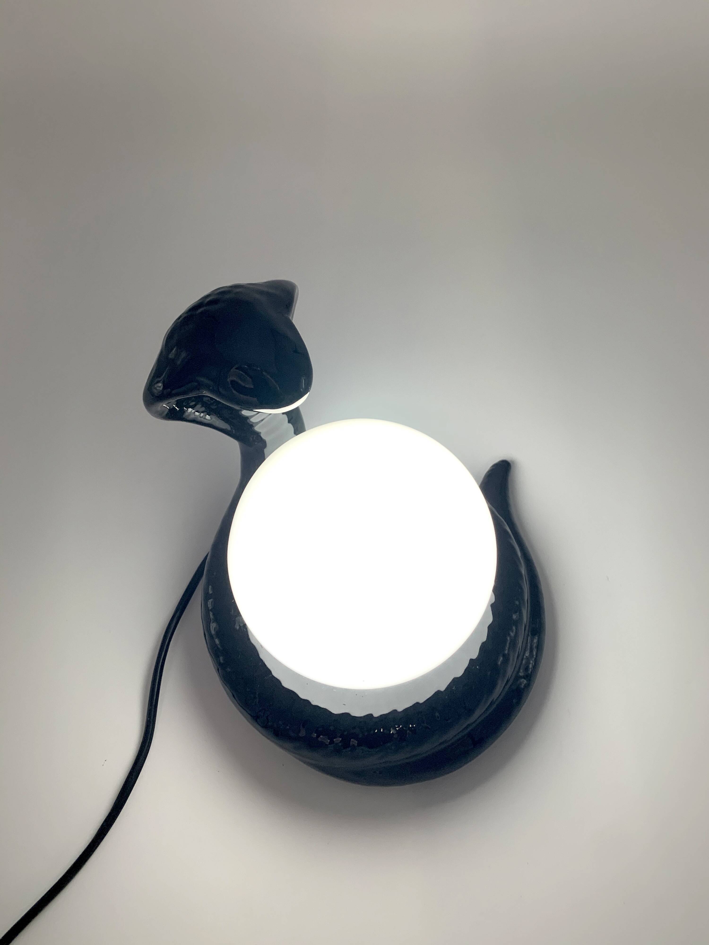 Black ceramic cobra lamp