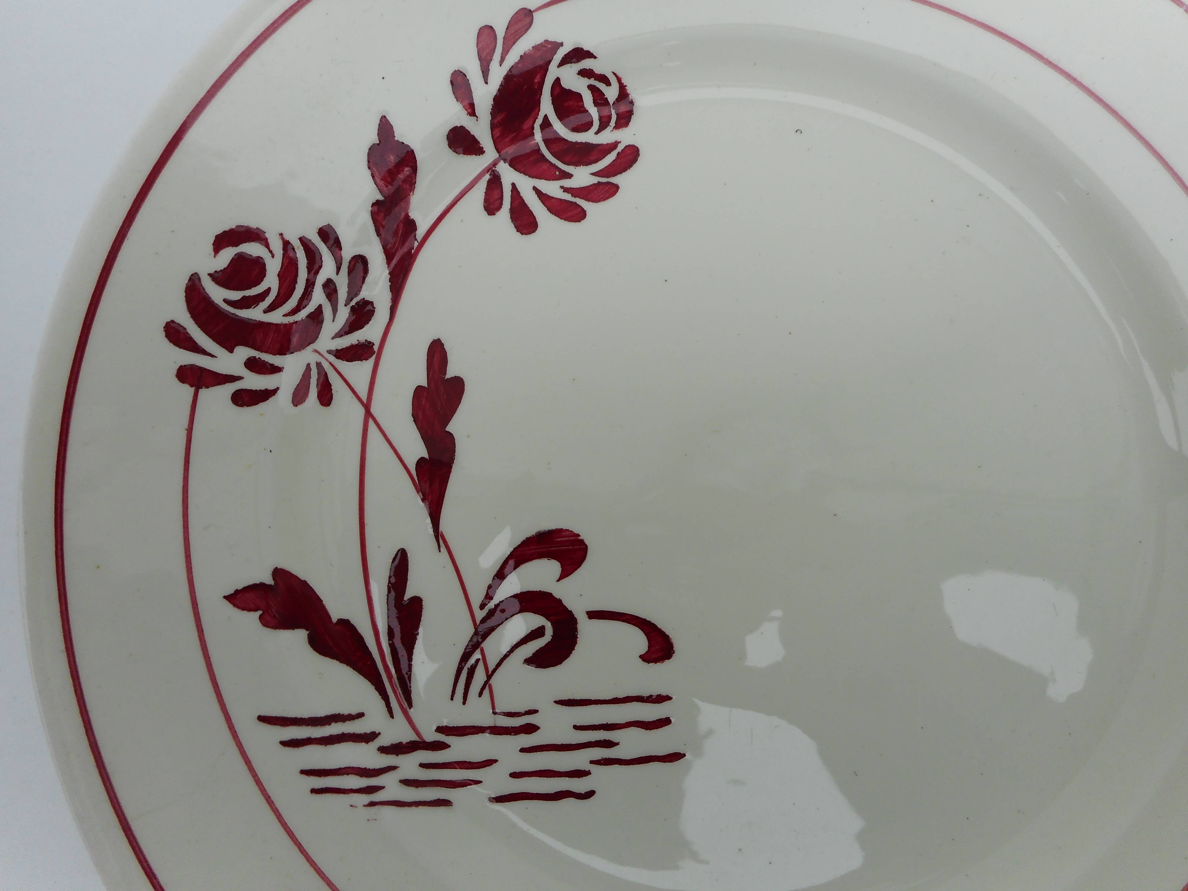 Six flat earthenware plates