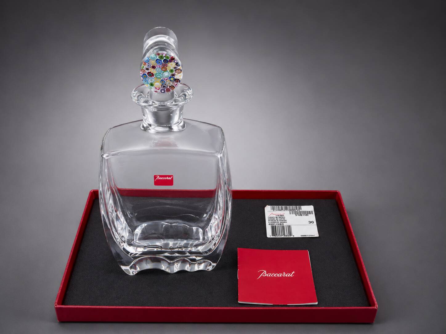 Baccarat crystal carafe with millefiori stopper and original box.