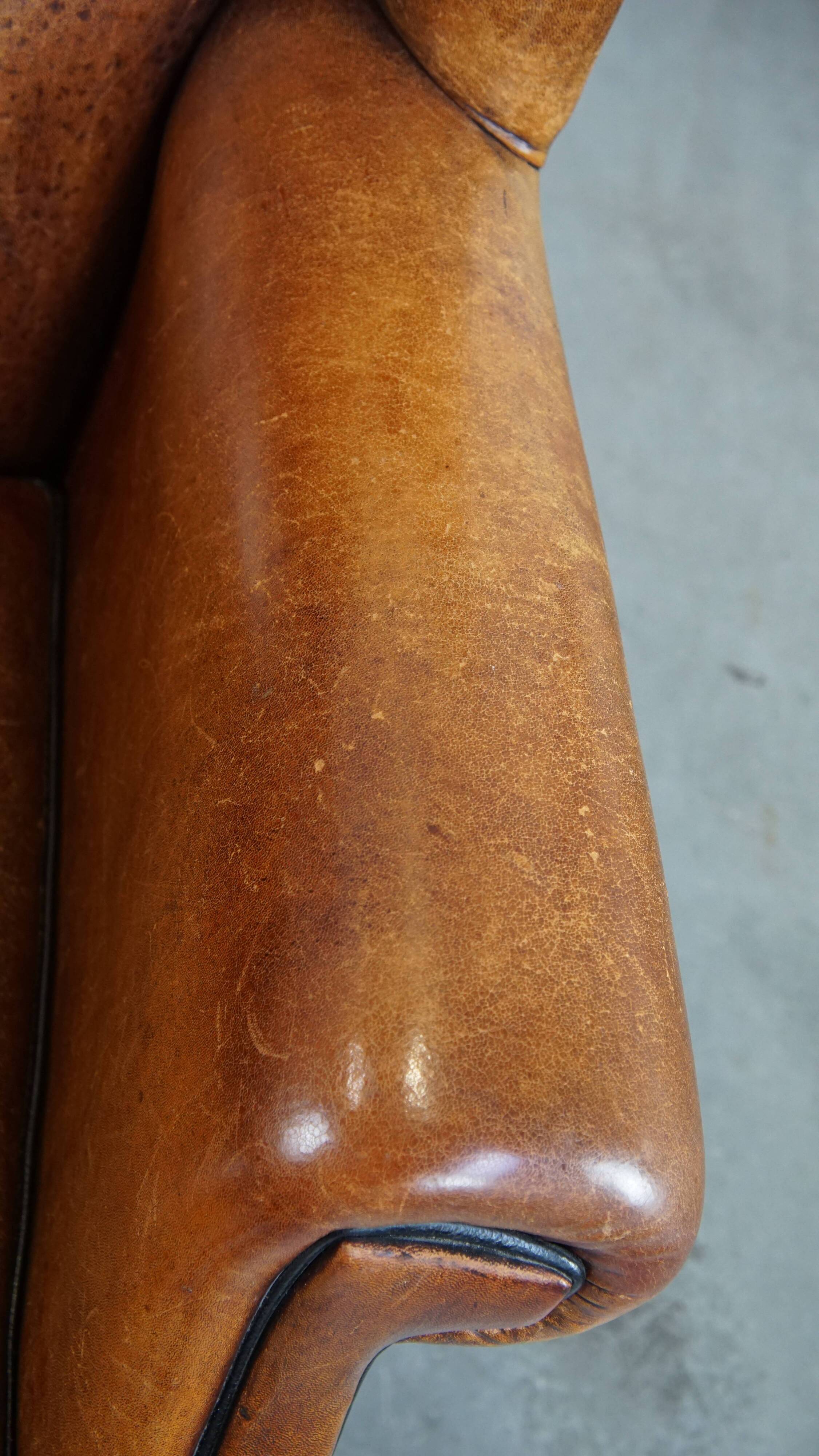 Fauteuil à oreilles en cuir de mouton vintage de style anglais