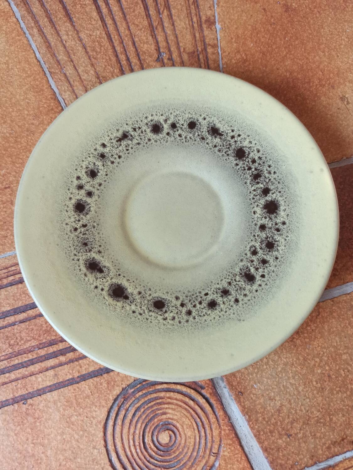 A pair of vintage glazed stoneware cups and saucers.