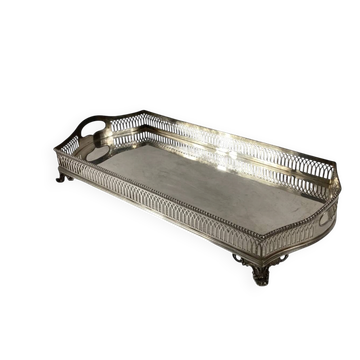 Important silver-plated metal table in the Louis XVI style.