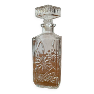 Antique bottle with flower engravings