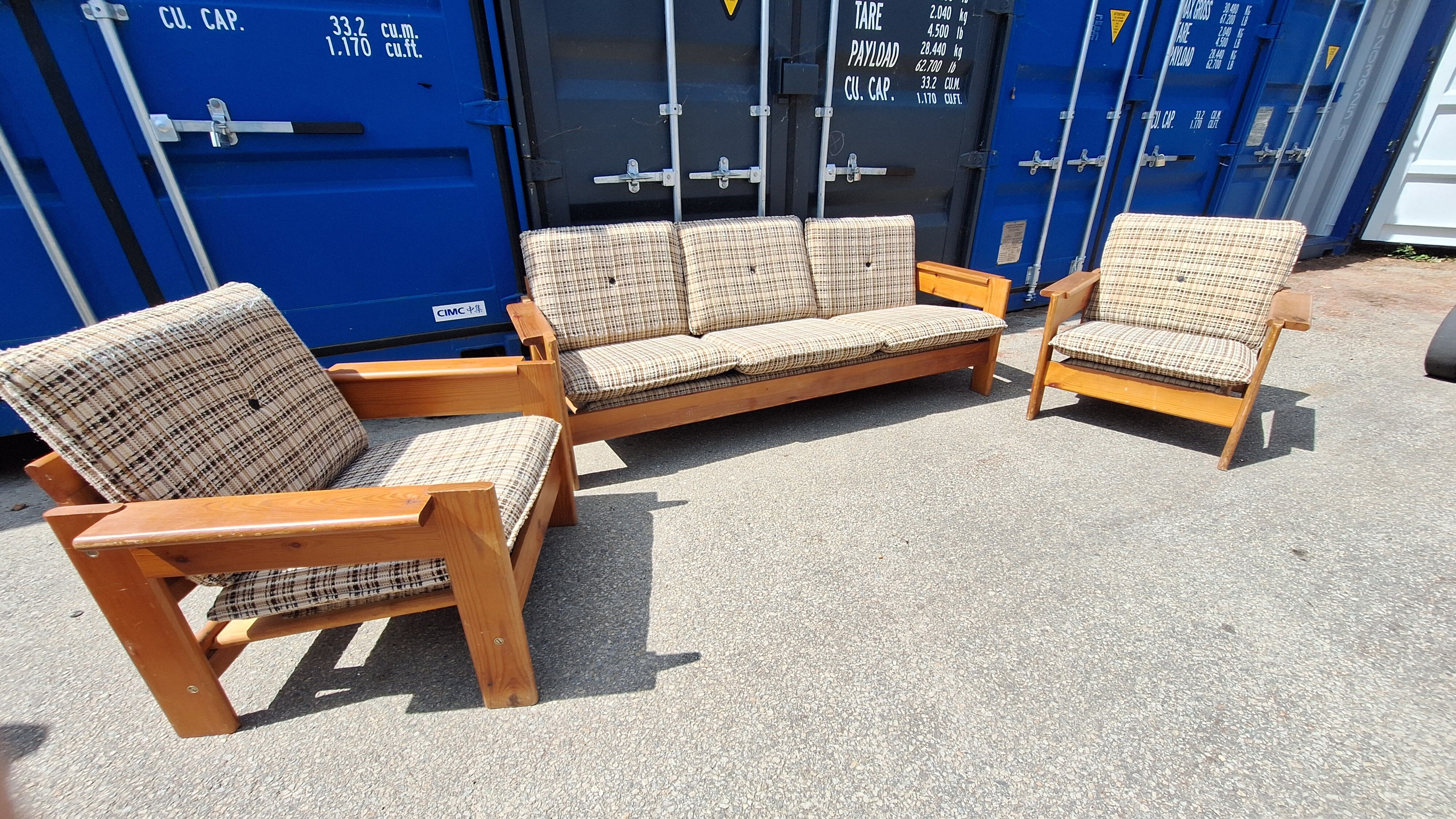 Brutalist-style bench and armchairs in 1970s pine.