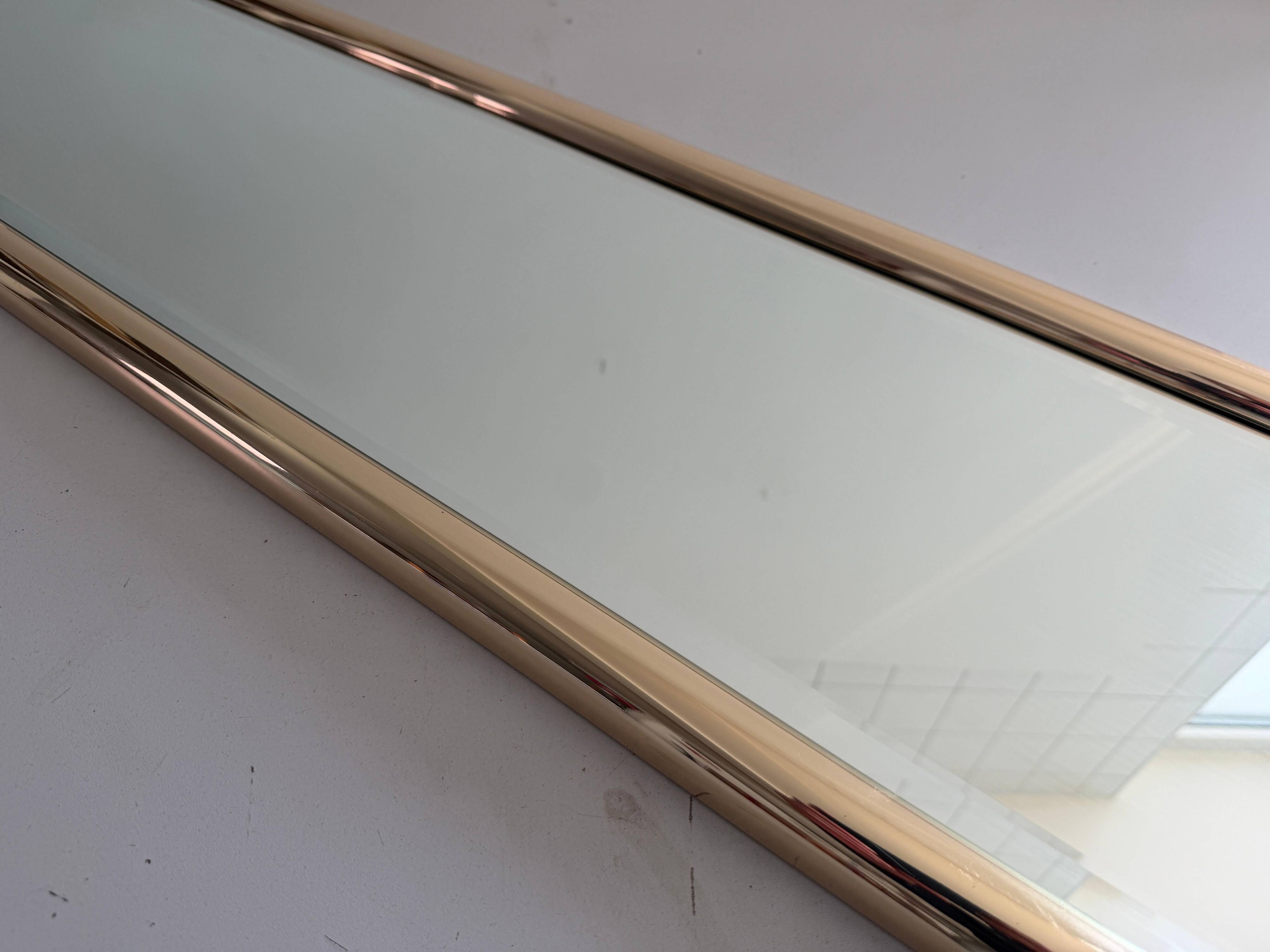 Rectangular wall mirror with a gold metal frame by Schöninger, 1970s, Germany.