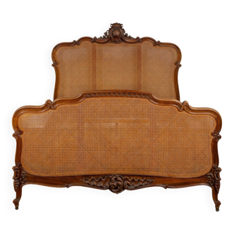 Louis XV style bed in carved and caned beech