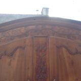 Louis XV Nantaise wardrobe carved with grape clusters, cherry gendarme hat at the end of the 19th century.