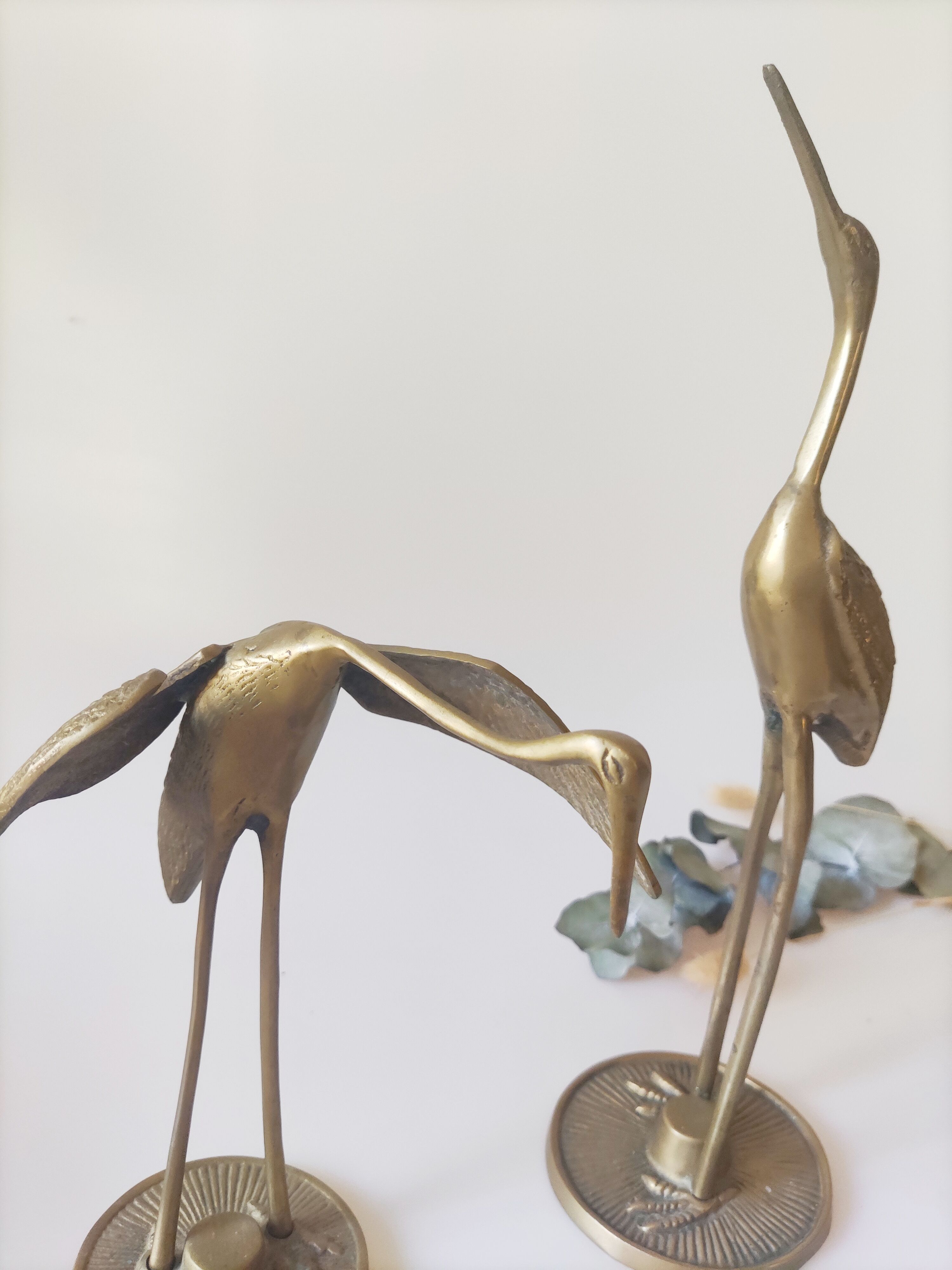 Brass heron duo