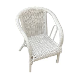 Children's armchair in vintage white wicker