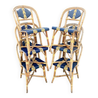 Six chaises "Maison Drucker" en rotin et fibres satinées.