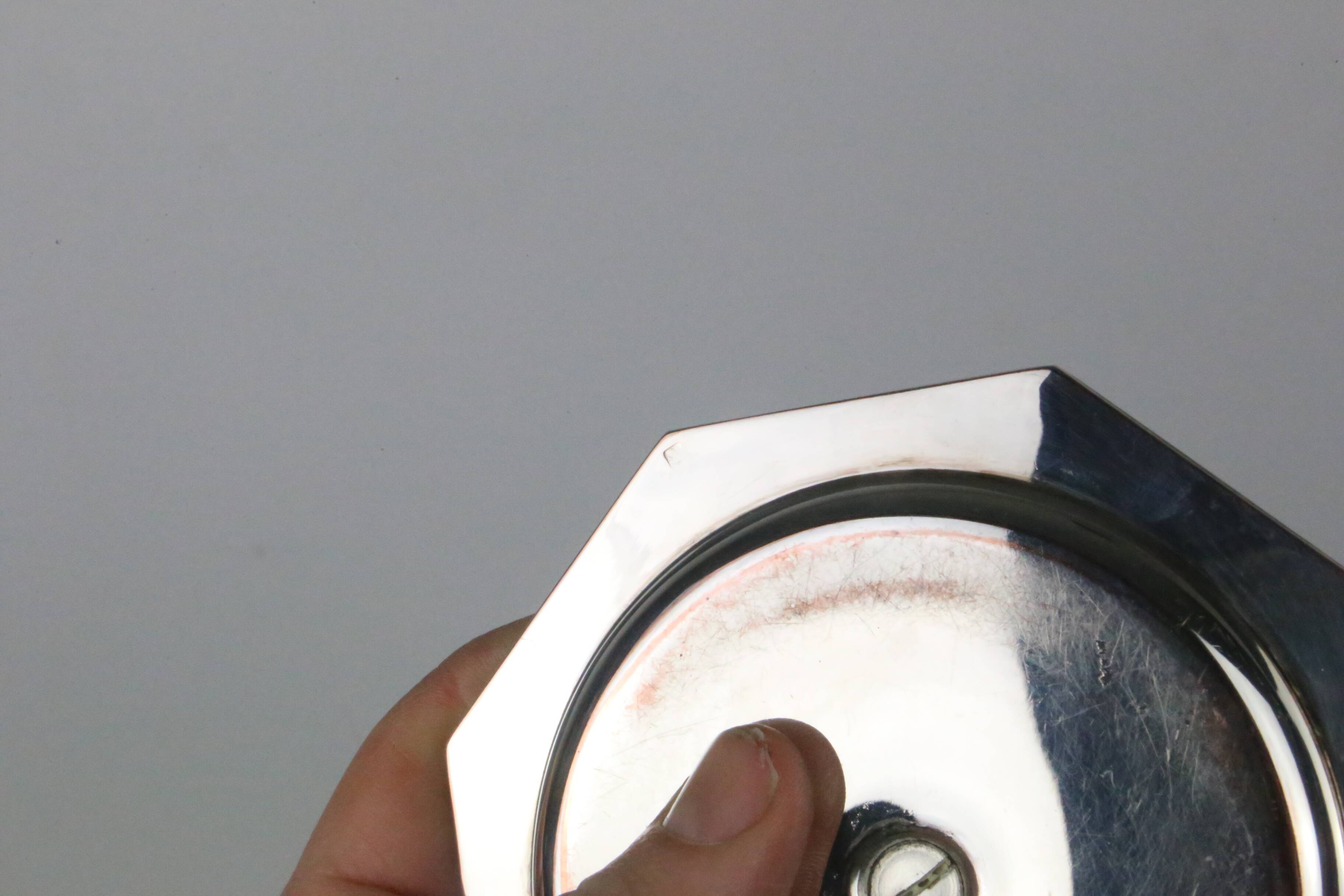 Pair of silver-plated metal candlesticks