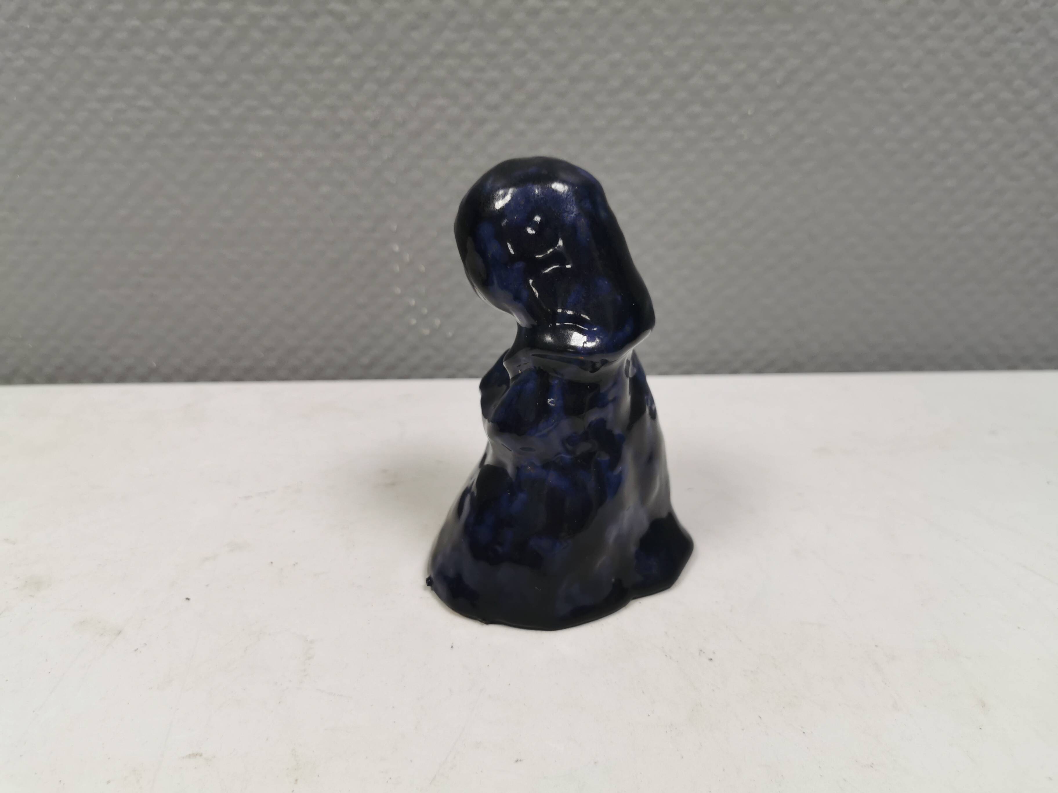 Lady figure in earthenware with shiny blue glaze