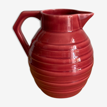 Raspberry-colored enamelled pitcher