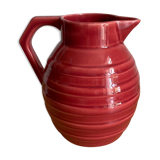 Raspberry-colored enamelled pitcher