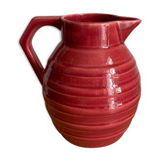 Raspberry-colored enamelled pitcher