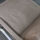One of two vintage Leather and metal arm chairs.