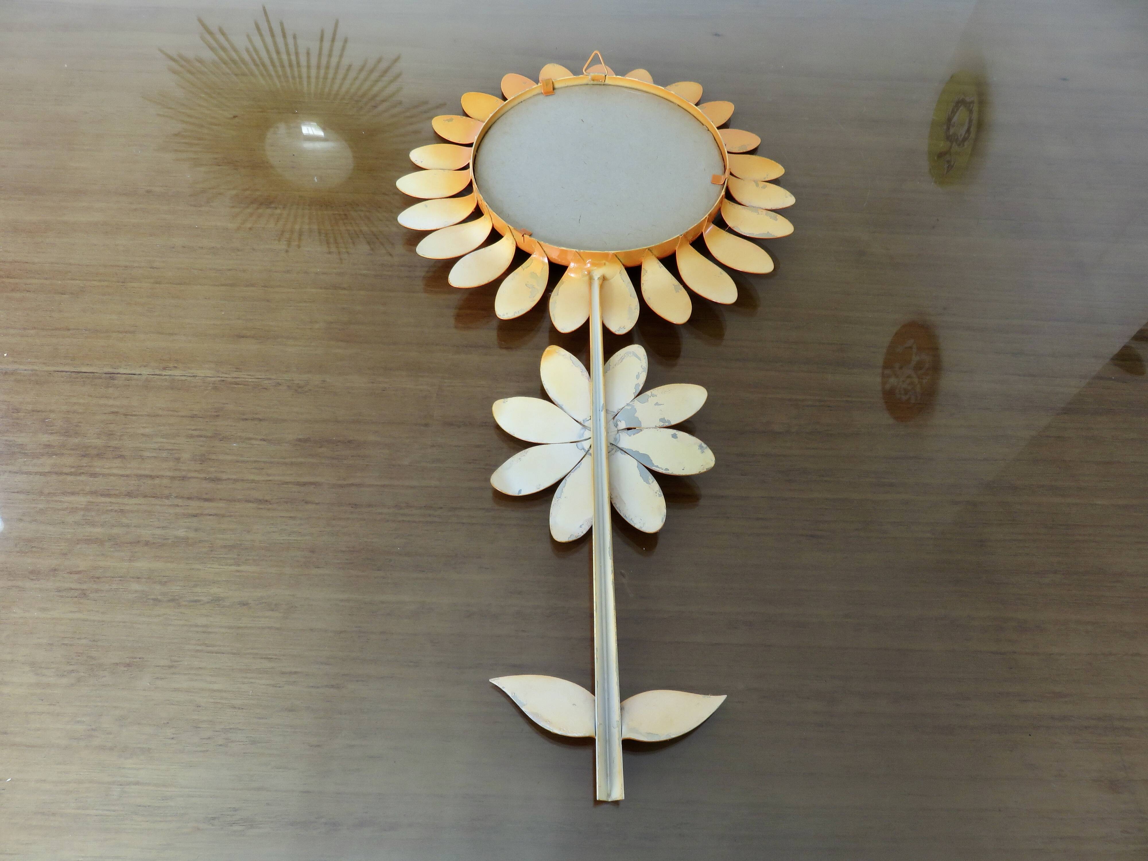 Large 1970s "flower" mirror in orange metal
