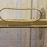 Five-panel golden metal fireplace screen from the 19th century.
