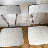 White and grey Formica chairs