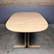Oval extendable dining table in beech with Danish design.